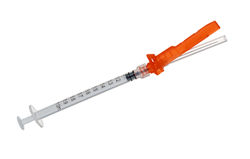 Automatic assembly machine for safety syringe